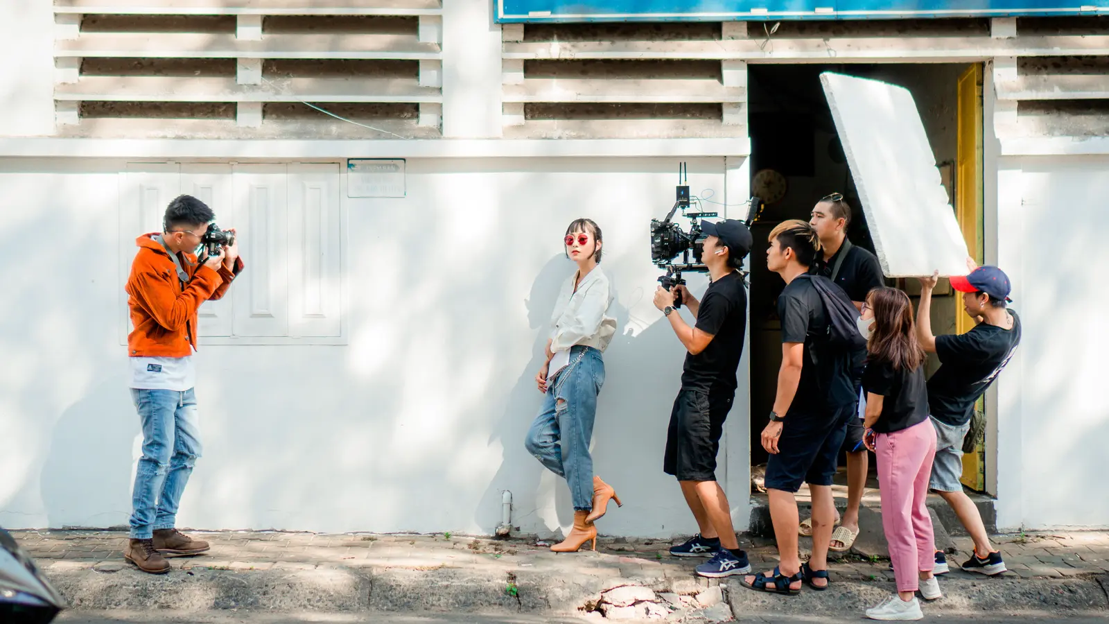 A film crew collaborating on an outdoor shoot